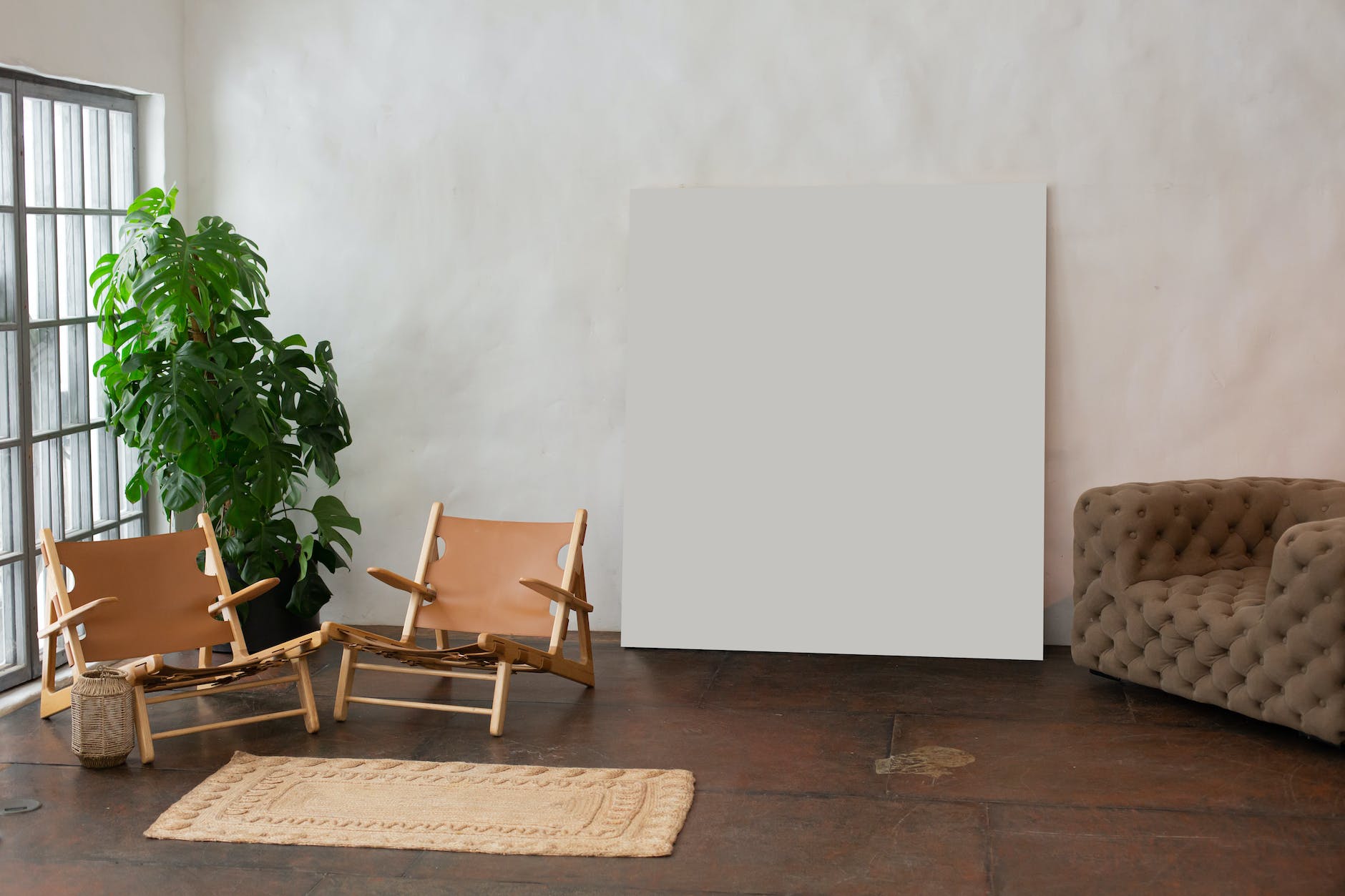 interior of light room with empty paint placed near wall